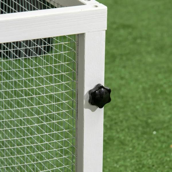 Steel wire rabbit hutch panel with black knob latch on the light grey frame