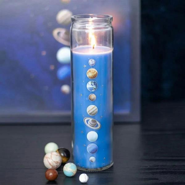 Blue solar-themed cedar tube candle in clear glass cylinder with printed planets