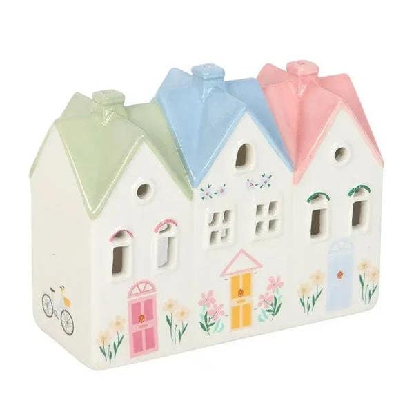 House incense burner and tealight holder, angled view of pastel houses with arched window cutouts