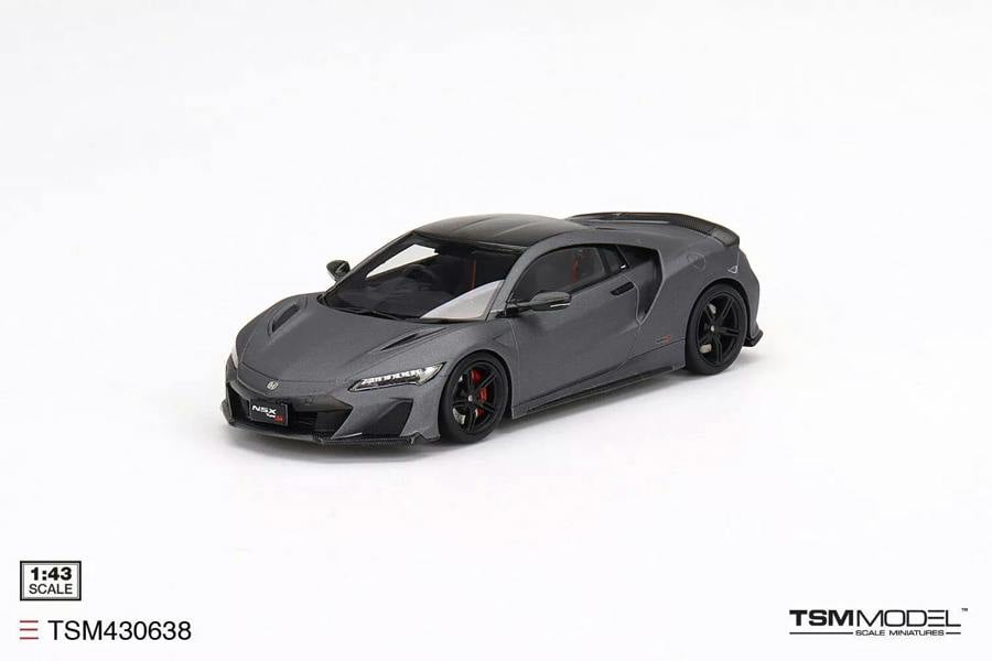 a grey sports car on a white background