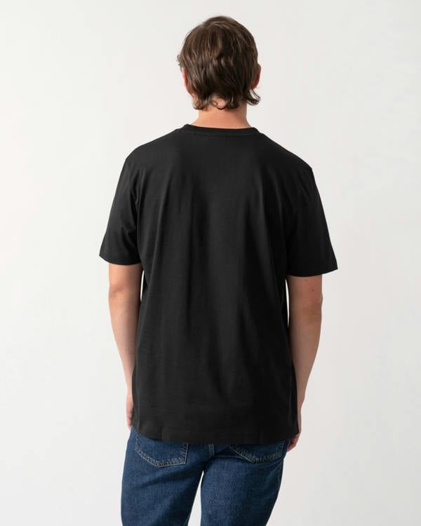 back of model wearing a HUGO Diflow Mens T-Shirt in Black 001