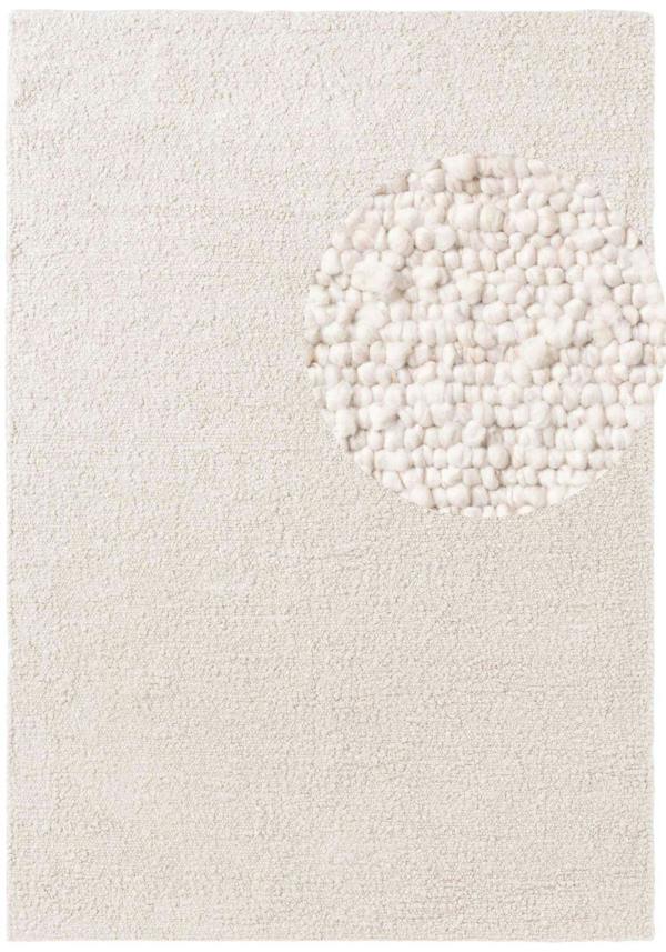 Textured white rug with a circular pattern