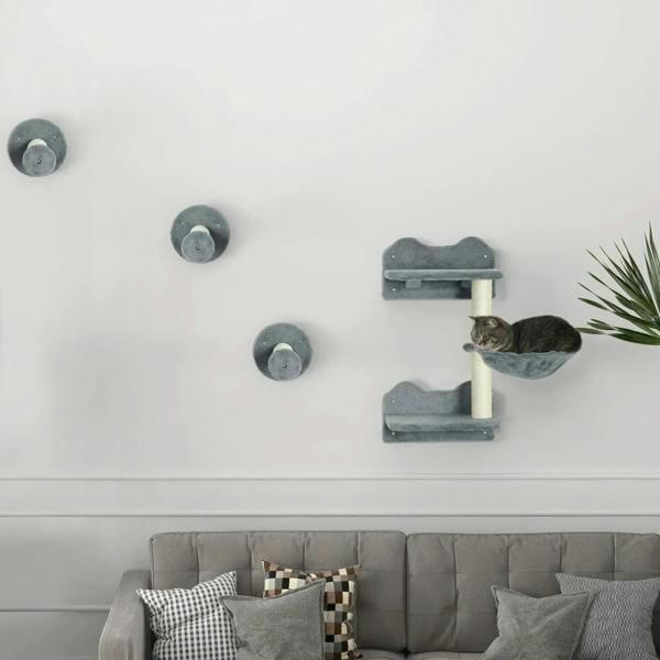 Grey wall-mounted cat tree with multiple circular scratching pads and two raised perches