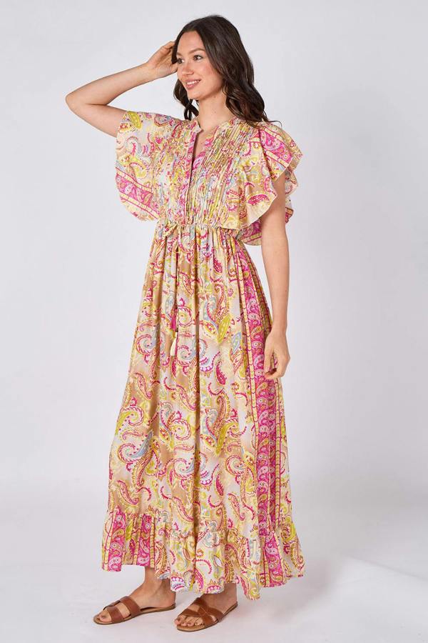 Woman wearing a colorful patterned dress on a white background