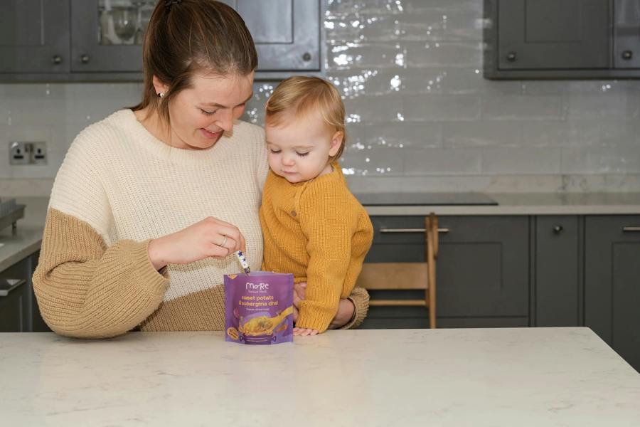 a mum and toddler preparing more toddler meal for dinner. 