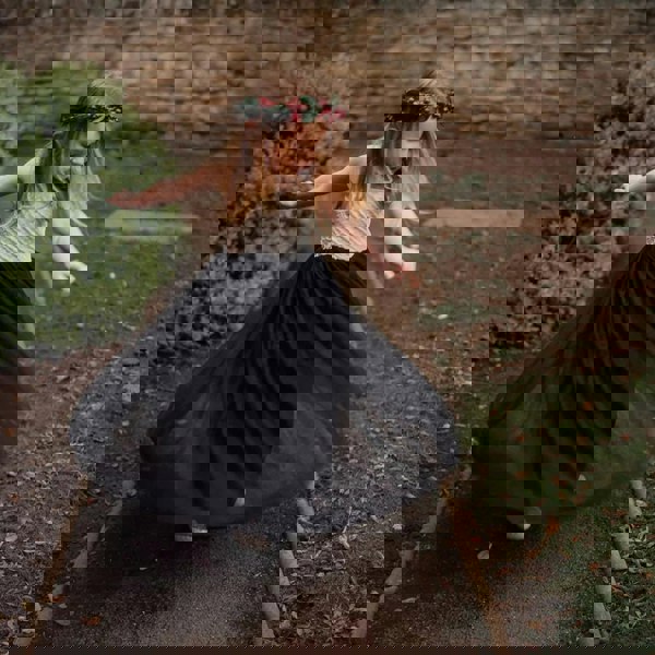 young girl swirling in flower girl dress