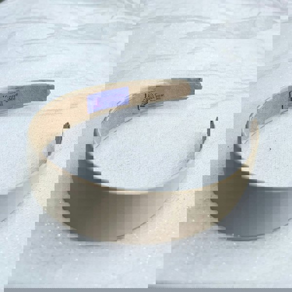 Beige hairband, smooth satin fabric, minimalist plain design, soft matte finish, structured slim style, versatile everyday accessory
