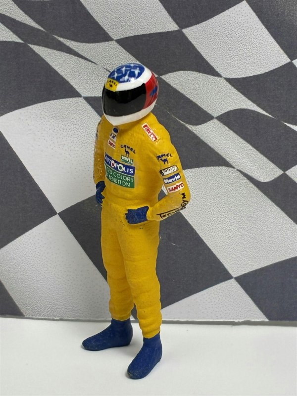 a toy figure of a race car driver