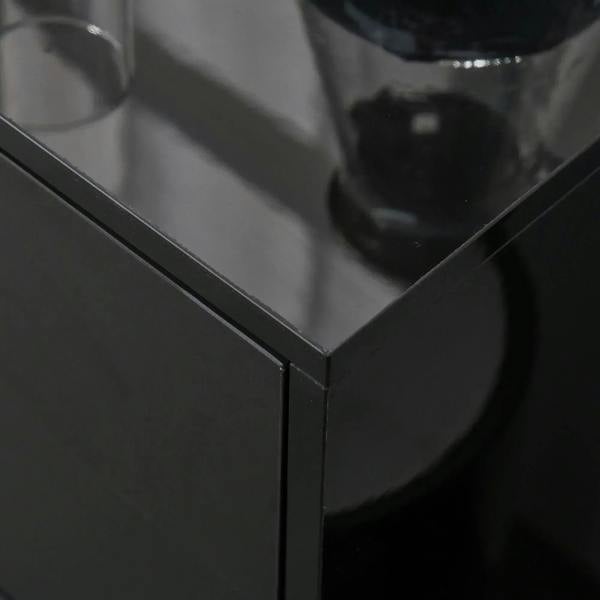 Close-up of black high-gloss cabinet corner edge and door seam