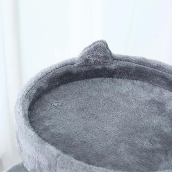 Grey plush top perch with raised rim on a cat tree, plus small hanging ball
