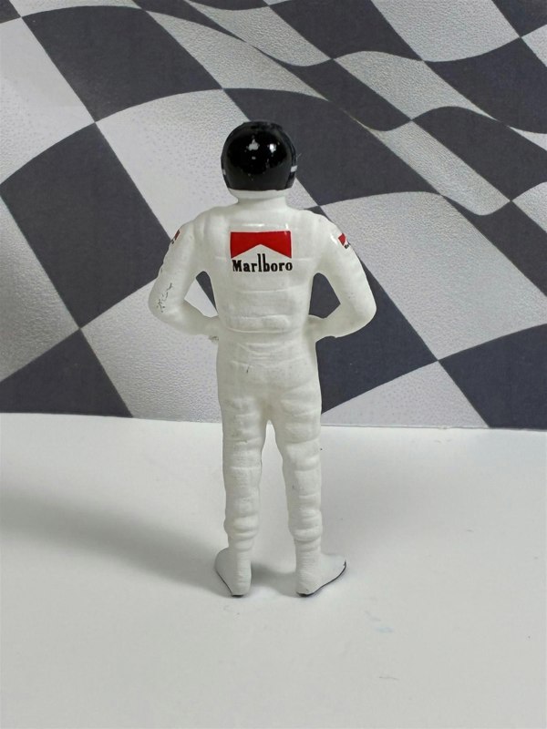 a toy figure of a man wearing a helmet