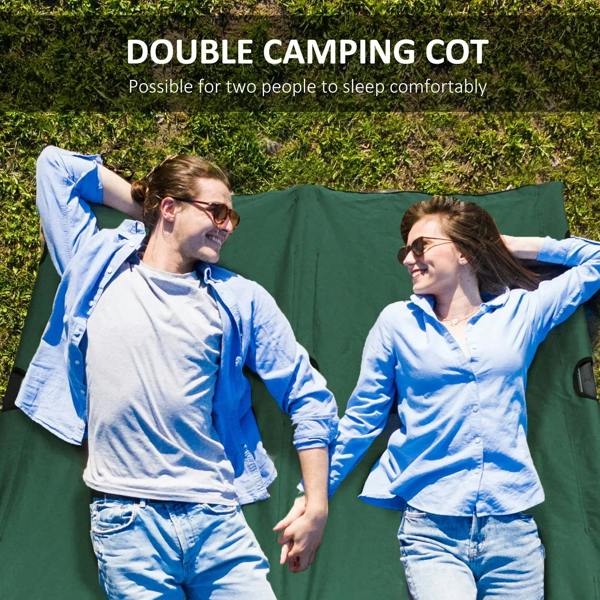 Green double camping cot bed in outdoor setting with two campers