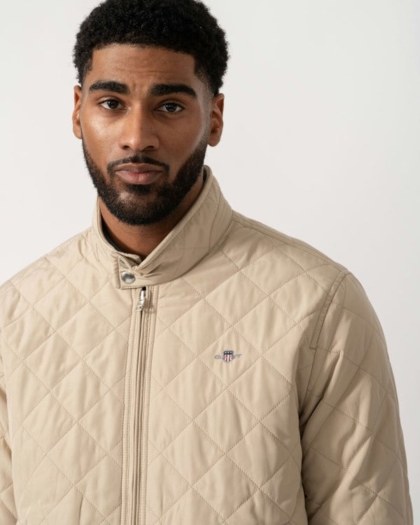 Model wearing GANT Mens Quilted Windcheater Jacket in 200 Oat Beige - detail