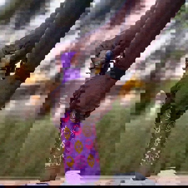 Man opening a Purple Metal Water Bottle