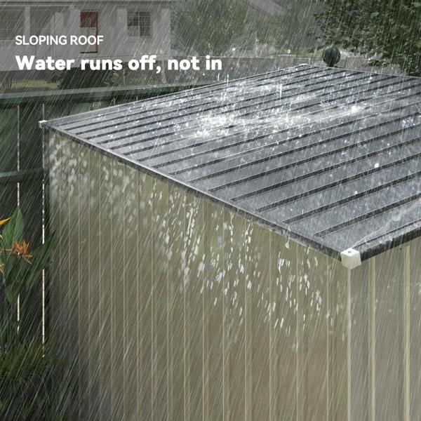White metal shed with sloping roof panel under rain for water runoff