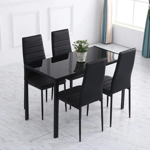 Black rectangular dining table with tempered glass top and metal legs, set with chairs