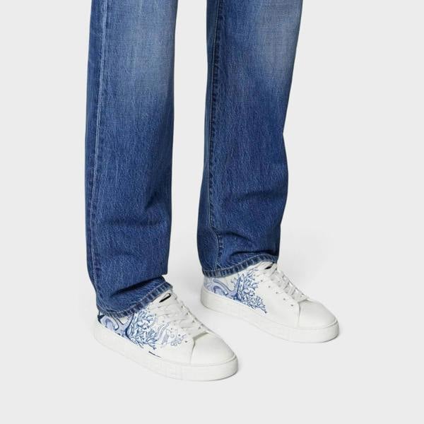 Supplied Fashion Versace Coral Theatre Greca sneakers in white leather with blue coral print and embossed side soles.