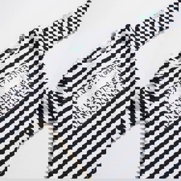 Close up of Just Done 9 Months Inside Baby Grow Black and White 