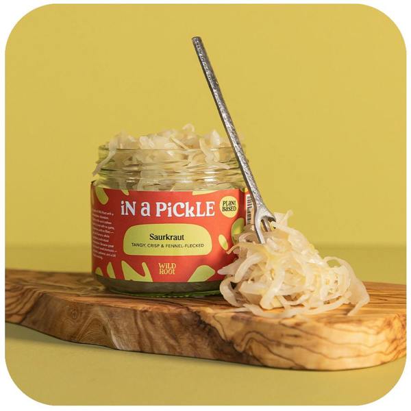 Sauerkraut jar opened with a spoon on the side 