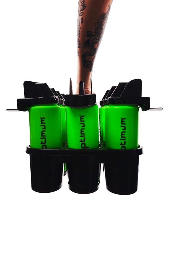 Hand carrying black Optimum carrier full of green water bottles by the handle - Optimum