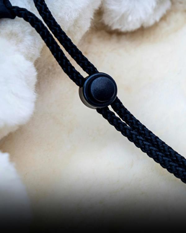 Close-up of footmuffs black cord