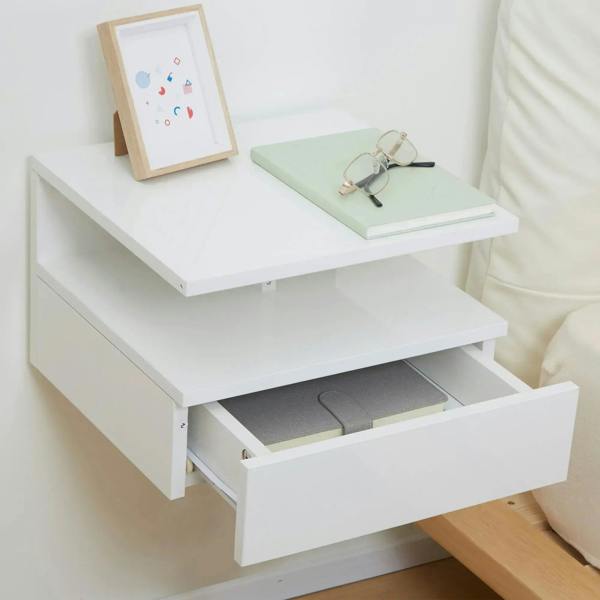 White floating bedside table with open drawer storage and two-level open shelves