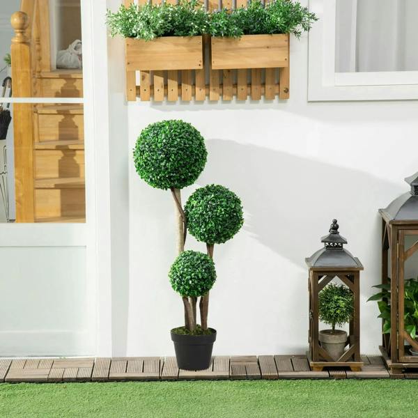Artificial boxwood ball topiary tree with dark green spheres on slim trunks, in black pot