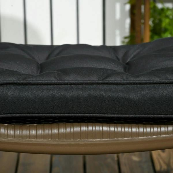 Close-up of black seat cushion with tufted top and stitched edge