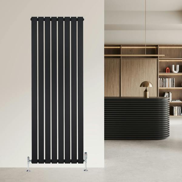 Sleek black flat single column radiator, 1600 x 560mm, mounted on a wall, complementing modern interior design with vertical lines