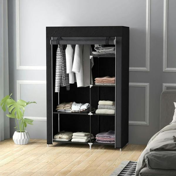Black foldable fabric wardrobe standing in a room with open door and organized shelves.