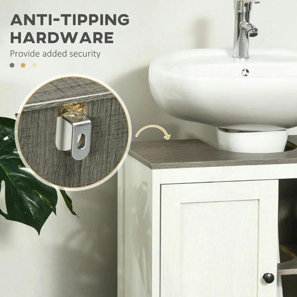 White bathroom sink cabinet with anti-tip hardware detail near side wall.