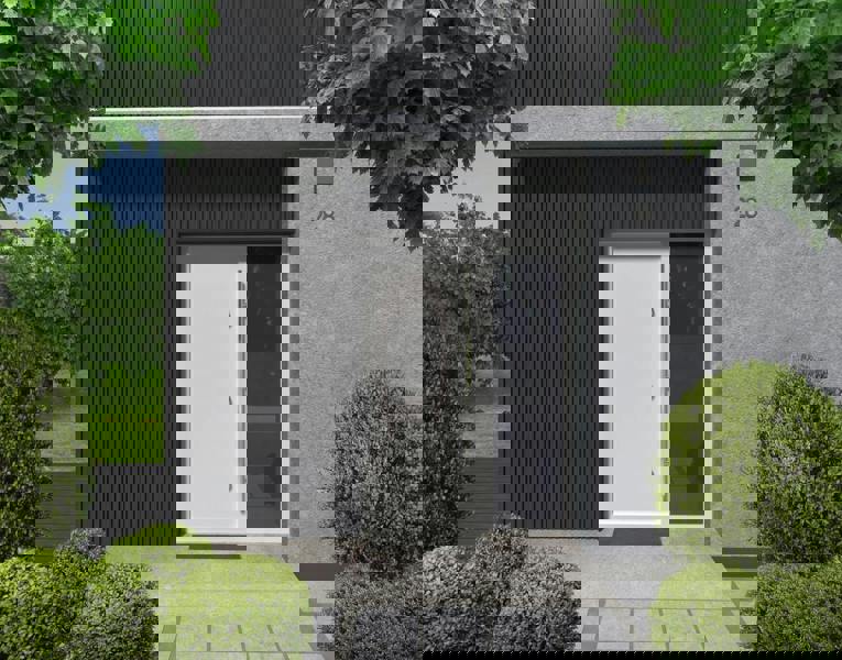 Modern house exterior with a white door and black slatted cladding and gray walls, surrounded by greenery.