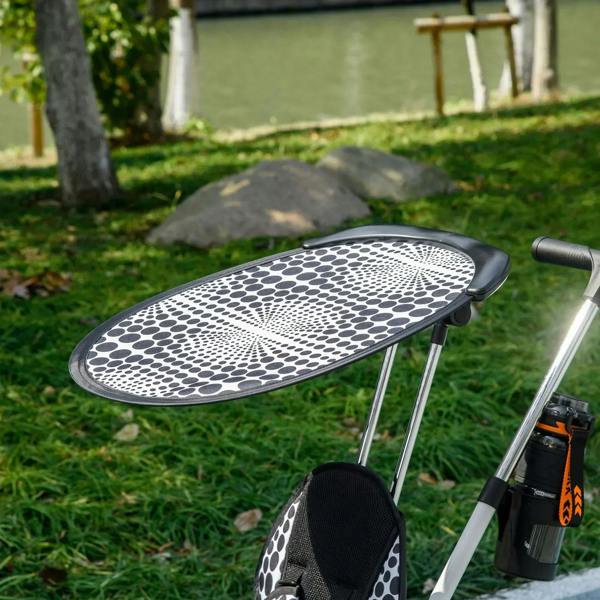 White tricycle with removable canopy and black-and-white seat on the push handle