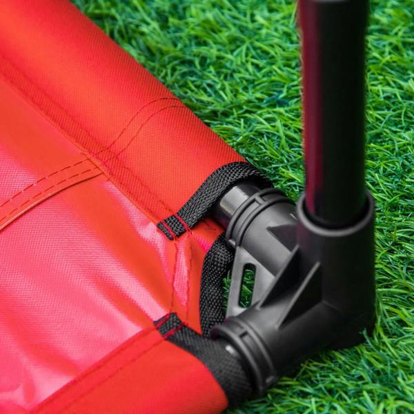 Corner strap detail on a red elevated pet bed with black leg joint attachment