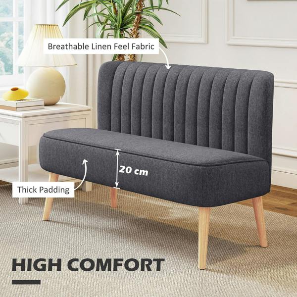Dark grey padded loveseat sofa with tufted back, rounded arms, and light wood legs
