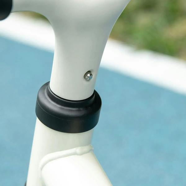 Children's balance bike seat post with black clamp ring and screw