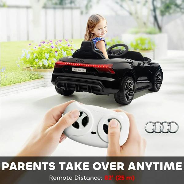 Black kids electric ride-on car with remote controller, rear view with child
