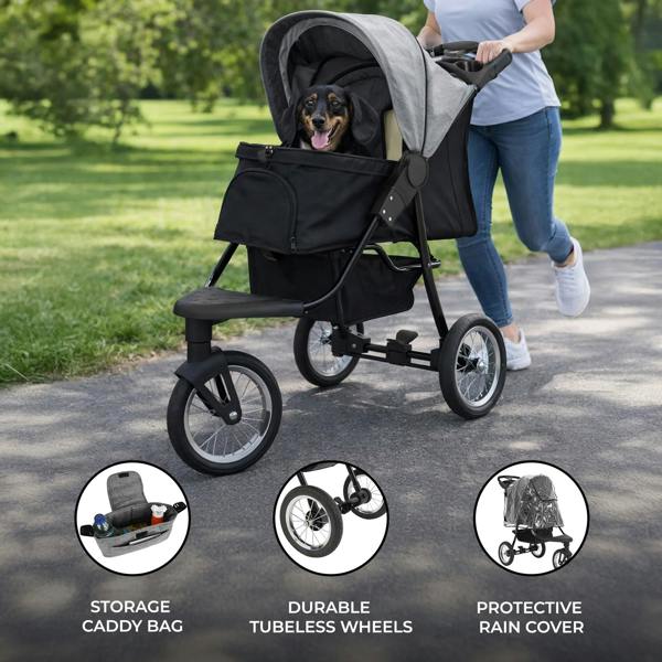 Grey pet jogger with a protective rain cover, storage caddy, and durable tubeless wheels, featuring a happy dog inside while being pushed on a path