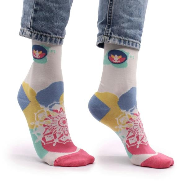 Light gray socks with colorful round graphic, blue/yellow shapes, and pink mandala