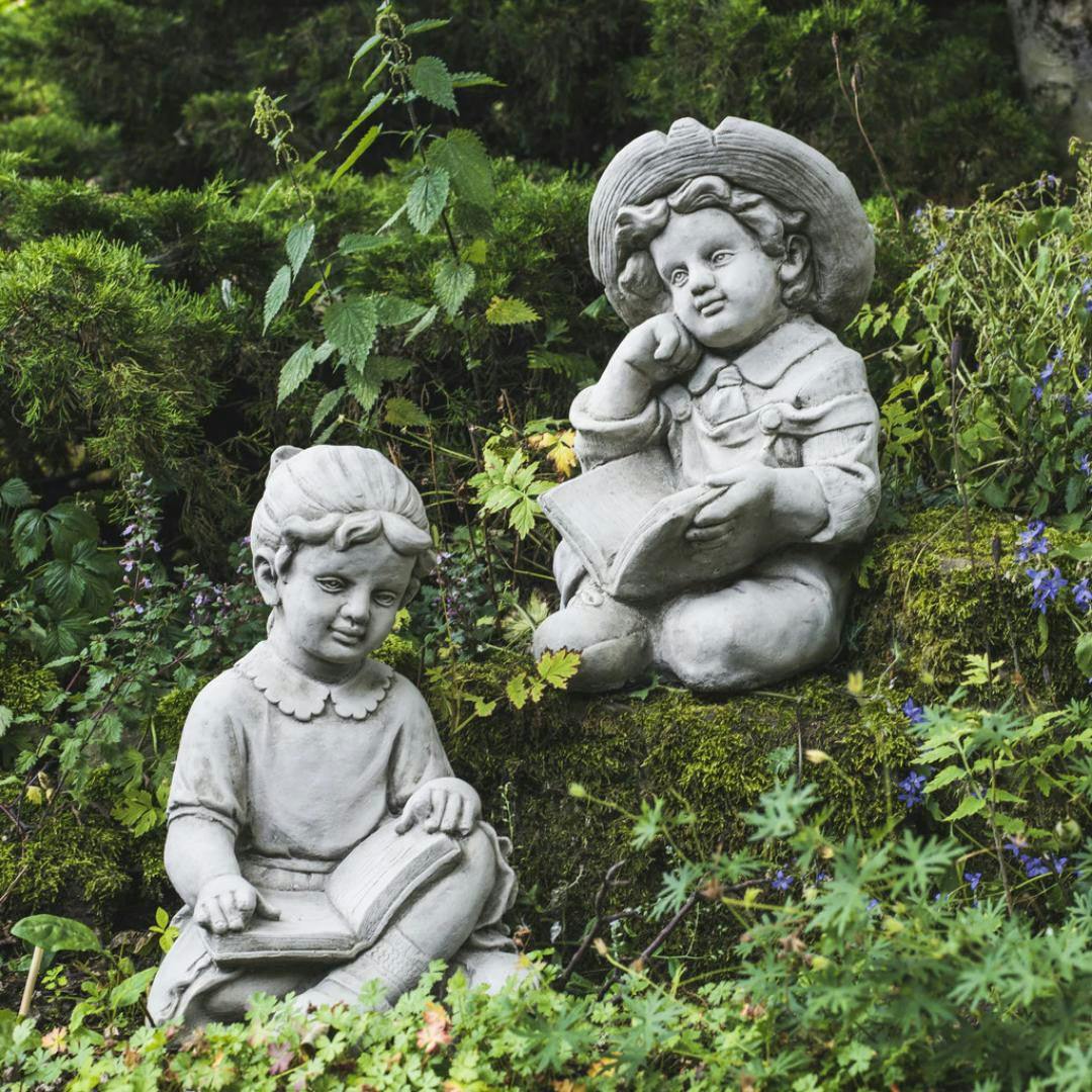 Rackhams Boys Large Reading And Girl Statues In Sitting Pose