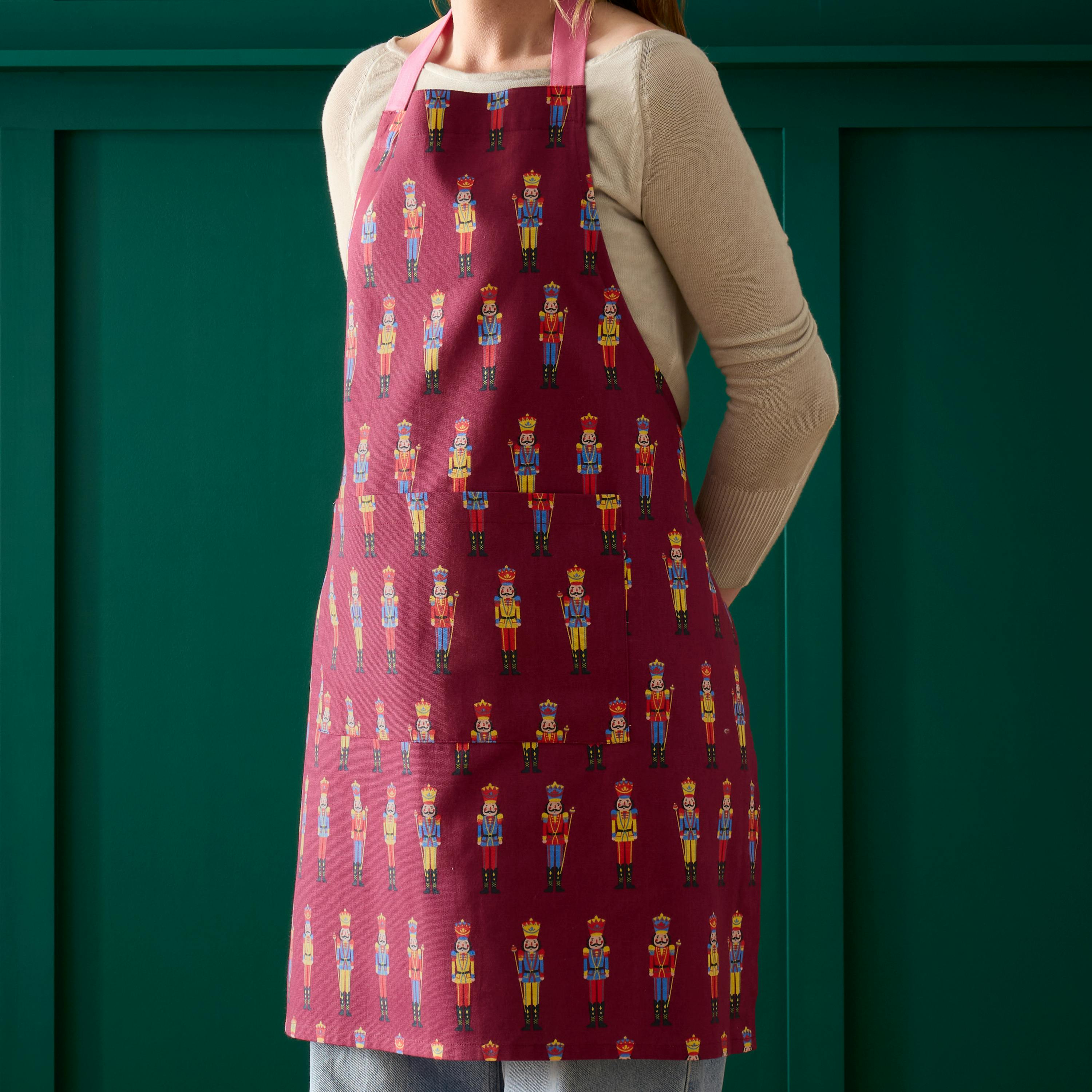 Catherine Lansfield 'Christmas Nutcracker' Cotton Kitchen Adult Apron in Plum - Image 3