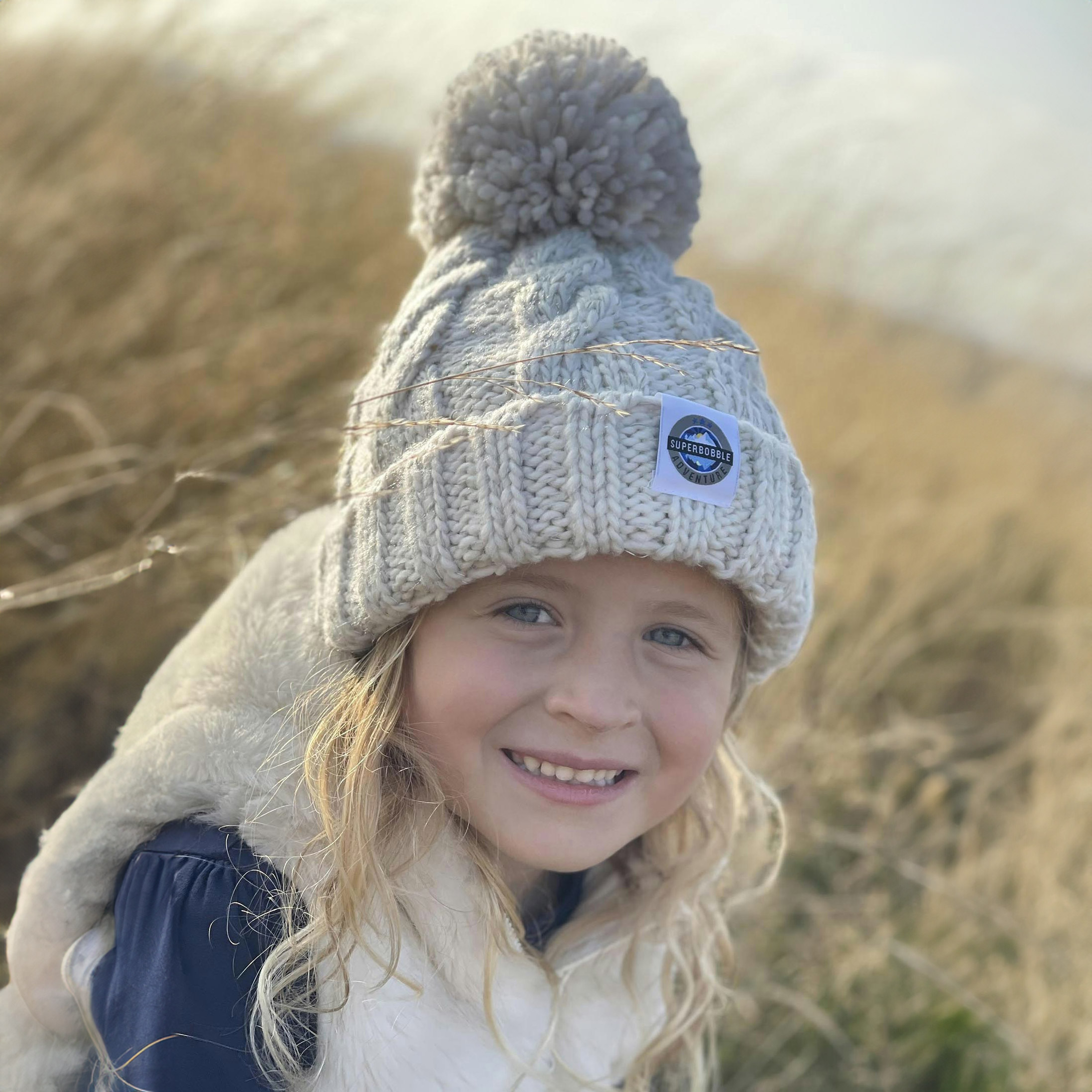 Superbobble Unisex Kids Cream Kids Cable Knit Beanie Bobble Hat - Oatmeal