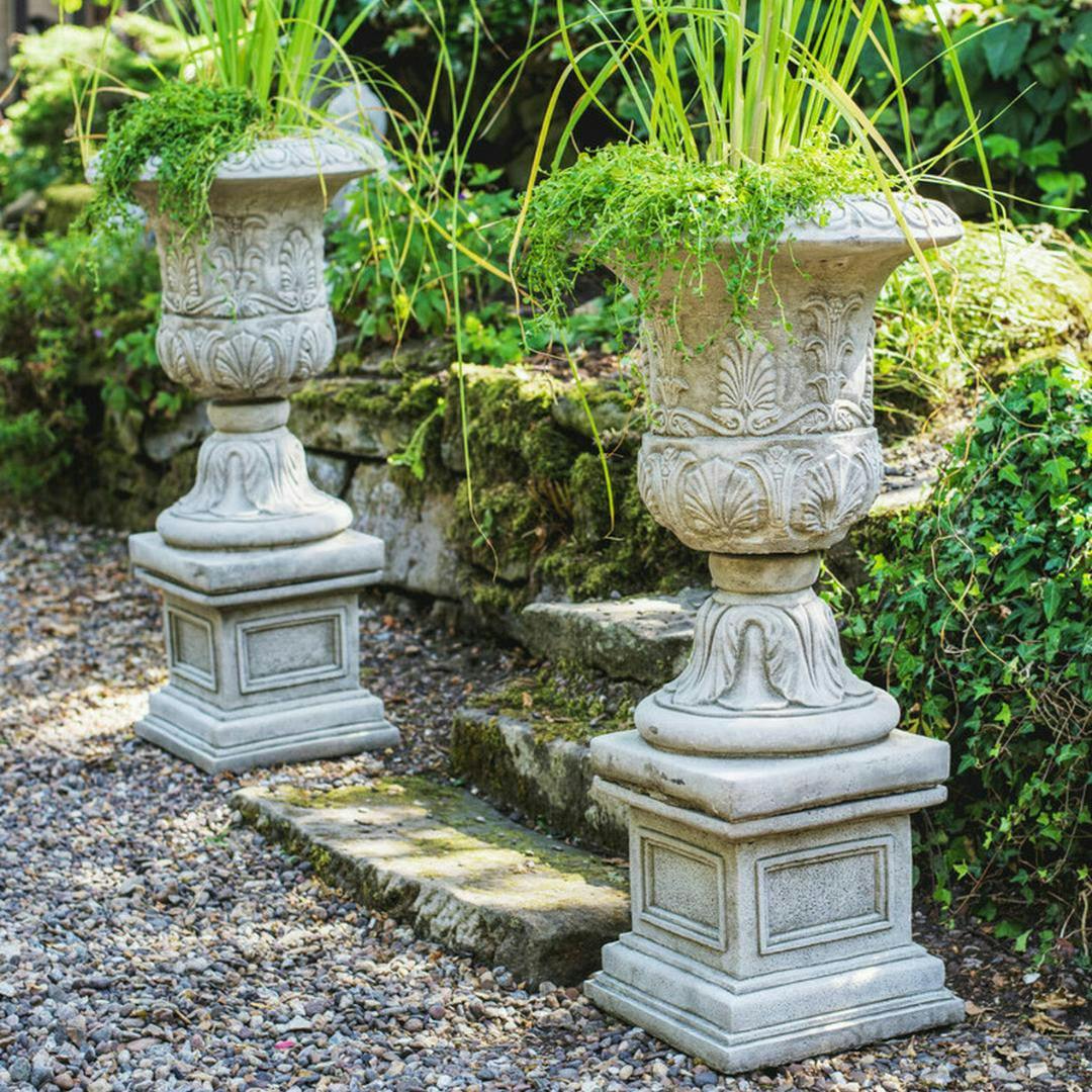 Rackhams Pair Of Large Victorian Stone Cast Urns With Plinths