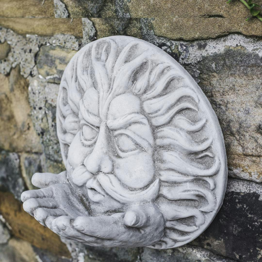 Rackhams Large Stone Cast 'Wind' Wall Plaque