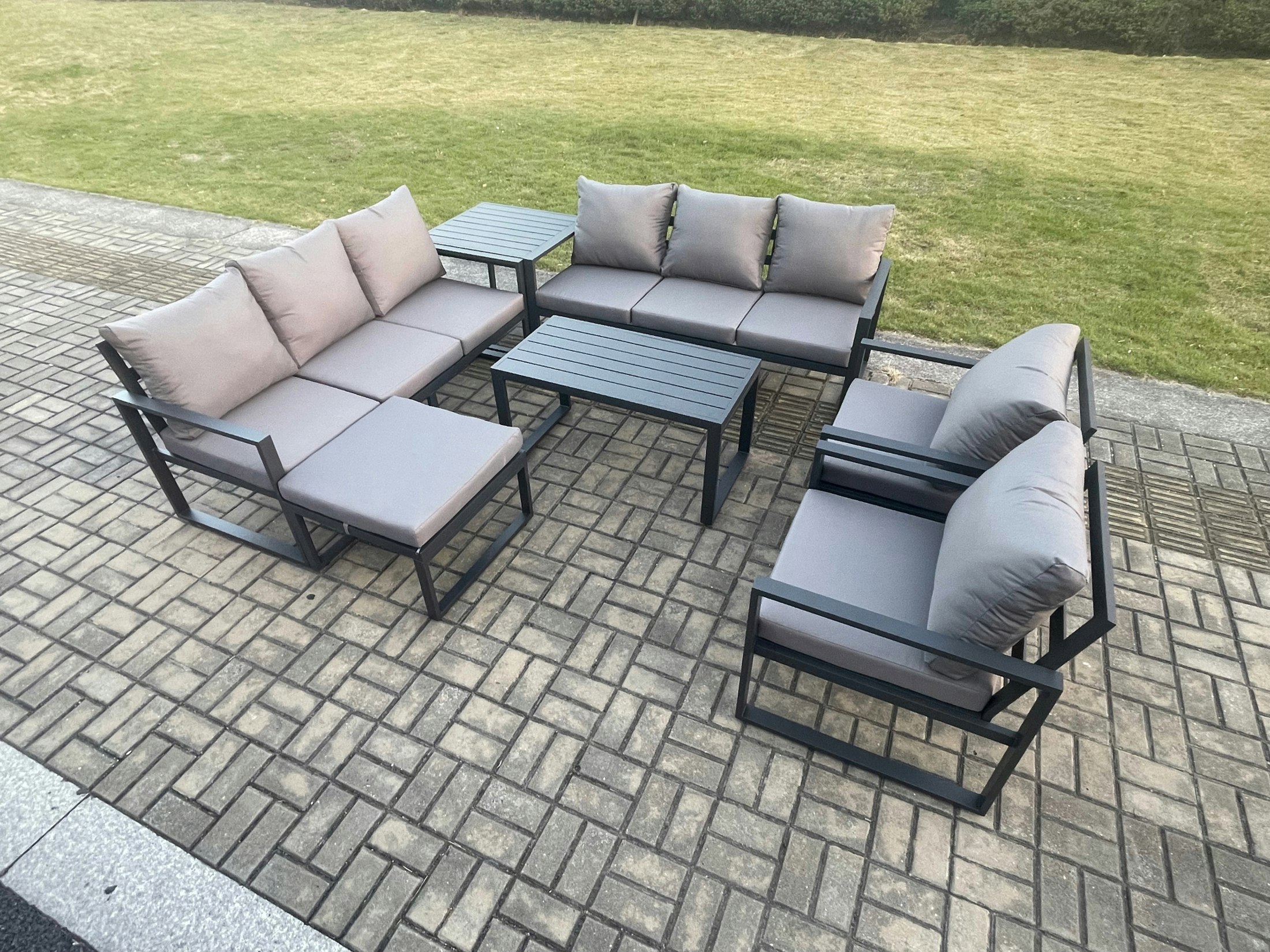Rackhams Dark/Grey Aluminium Outdoor Garden Furniture Set 9 Seater Garden Sofa With Oblong Coffee Table Big Footstool Side Table