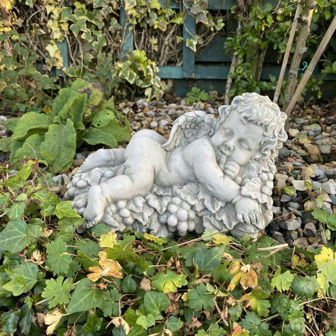 Osn Vintage Cherub Statue Laying On A Grape
