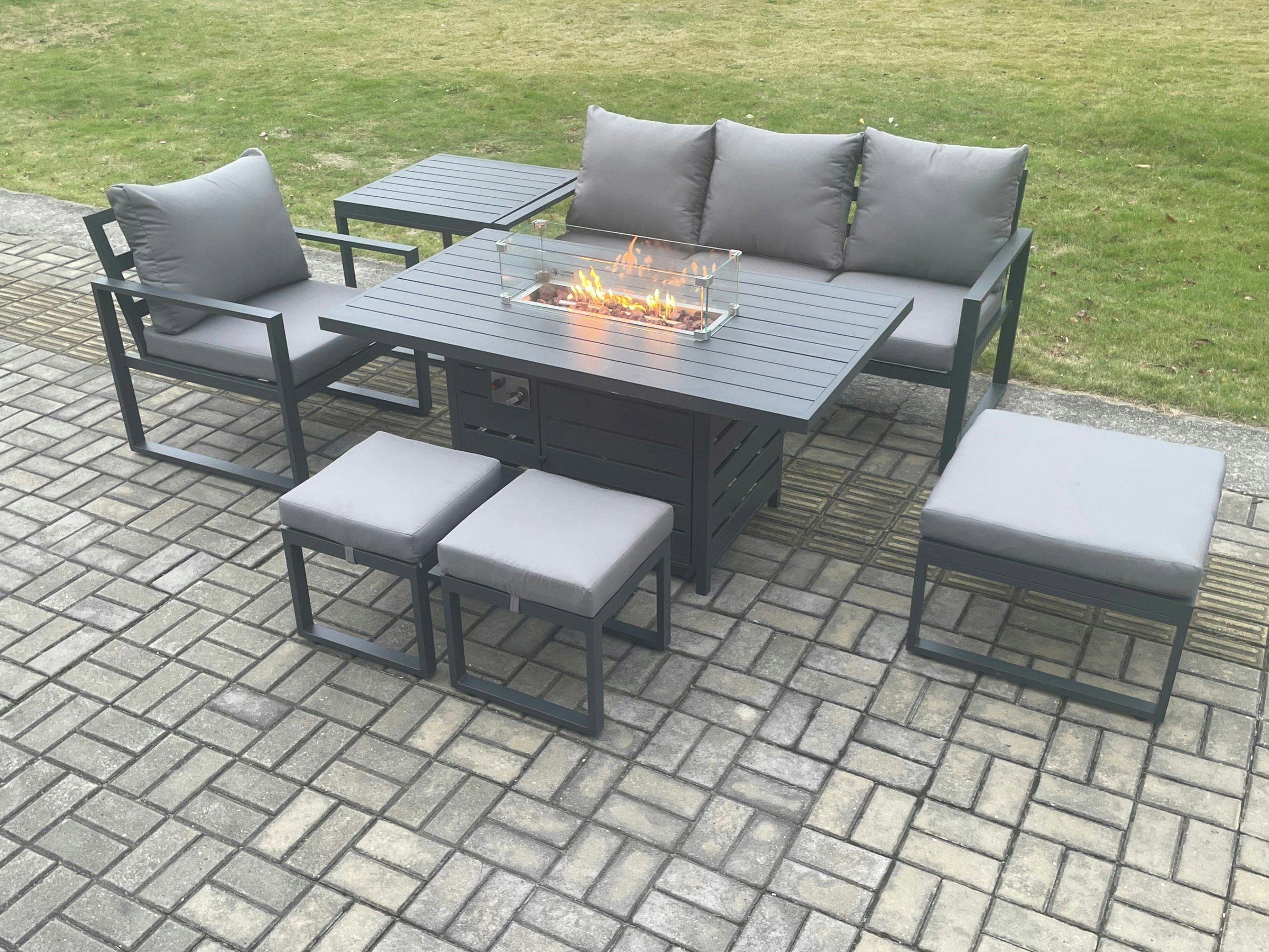 Rackhams Dark/Grey Aluminium 7 Pieces Garden Furniture Sofa Set With Cushions Gas Fire Pit Dining Table Set With 3 Footstools Side Table