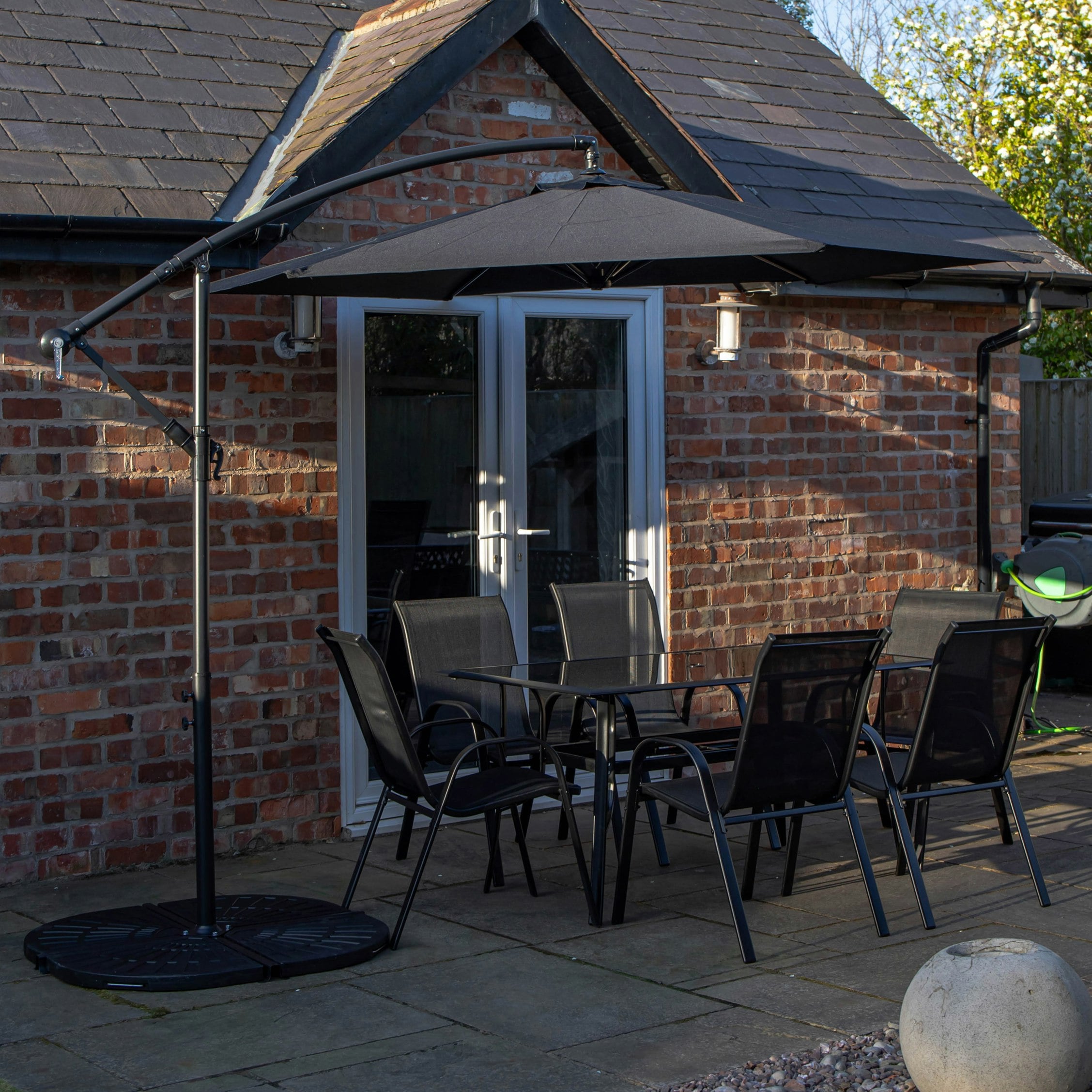 Rackhams Black Outdoor 6 Person Rectangular Glass Top Garden Dining Table Chairs With Banana Parasol And Base - Outdoor Furniture Sets