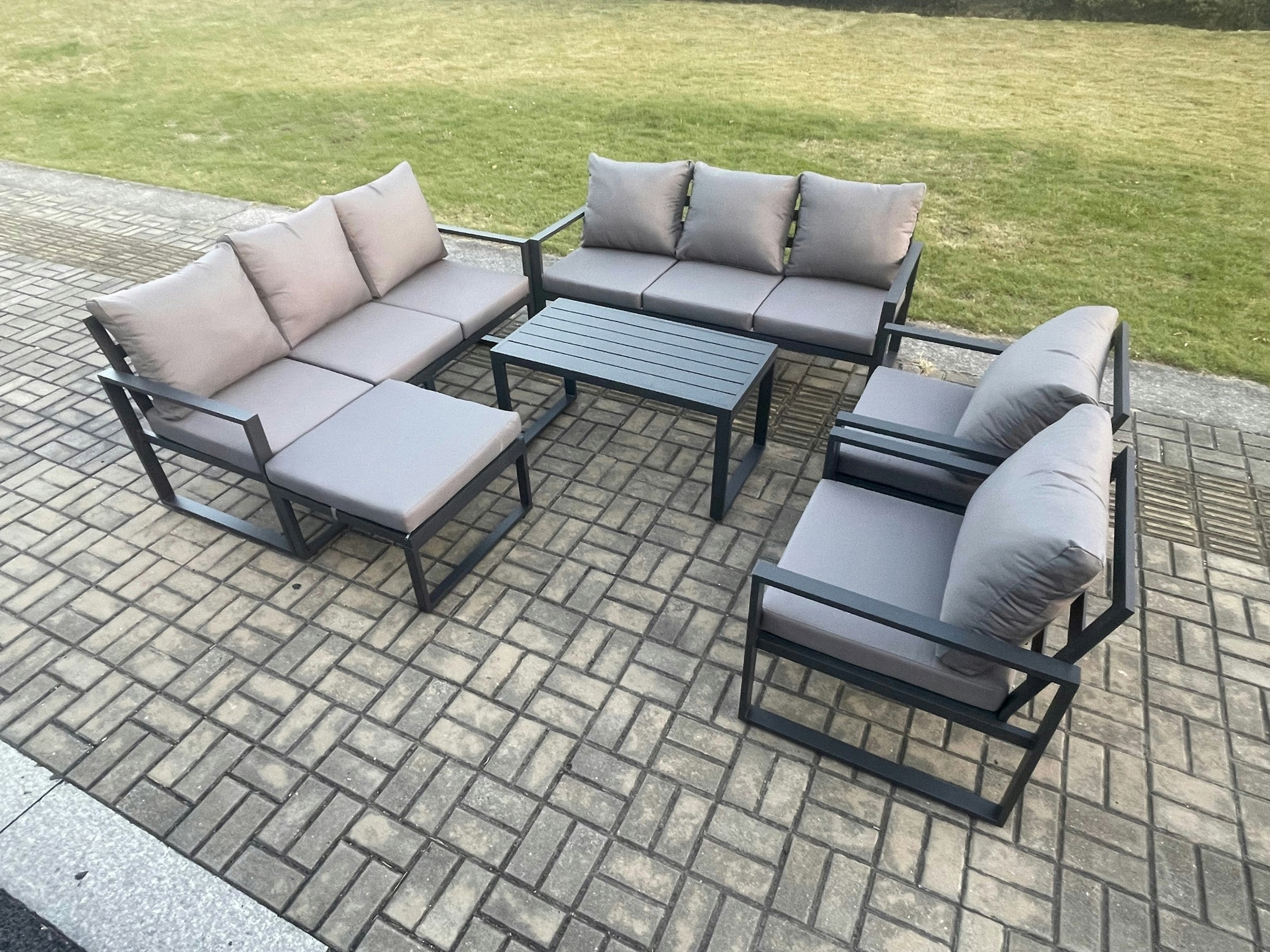 Rackhams Dark/Grey Aluminium Outdoor Garden Furniture Set 9 Seater Garden Sofa With Oblong Coffee Table Big Footstool