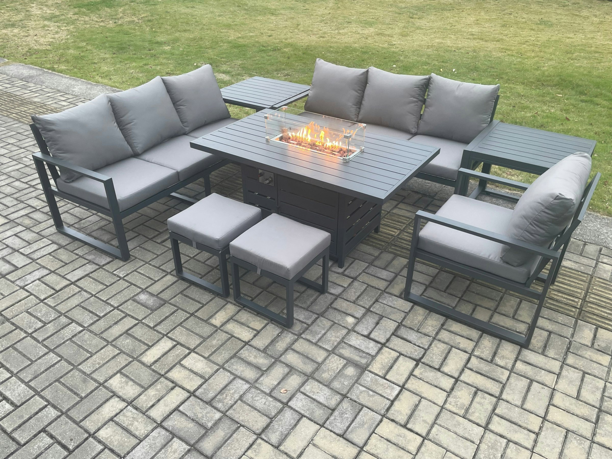 Rackhams Dark/Grey Aluminium 8 Pieces Garden Furniture Sofa Set With Cushions 9 Seater Gas Fire Pit Dining Table With 2 Side Tables 2 Small Footstools